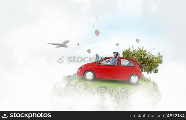 Woman in drawn car. Young humorous woman driving drawn funny car