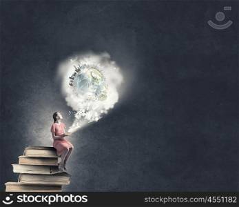 Woman in dress with book. Young girl sitting on stack of books and reading. Elements of this image are furnished by NASA