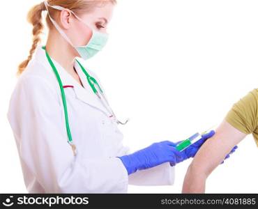 Woman in face mask and white lab coat. Doctor or nurse with syringe giving injection to patient isolated. Medical person for health insurance.