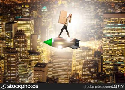 Woman in fast box delivery service on rocket