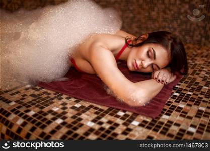 Woman in foam, turkish bath, hamam. Skin and body care. Woman in foam, turkish bath, hamam