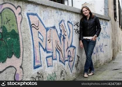 Woman in front of Graffiti Wall