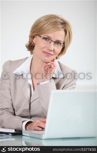 Woman in glasses at laptop computer