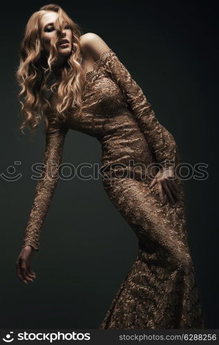 woman in gold dress