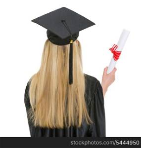 Woman in graduation gown with diploma . rear view