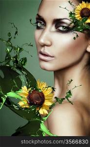 woman in green plant splash with sunflower
