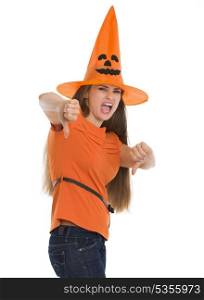 Woman in Halloween hat showing thumbs down