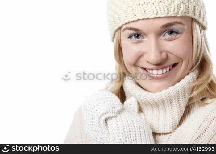 Woman in hat and mittens on a white background