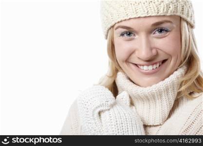 Woman in hat and mittens on a white background