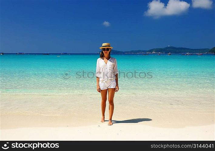 Woman in hat at beach
