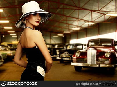 Woman in hat in retro garage