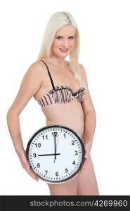 Woman in her underwear with a clock showing 9:00