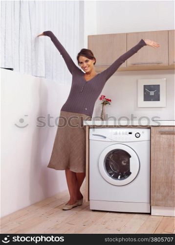 woman in kitchen near washing machine