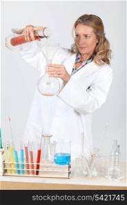 Woman in laboratory conducting experiment