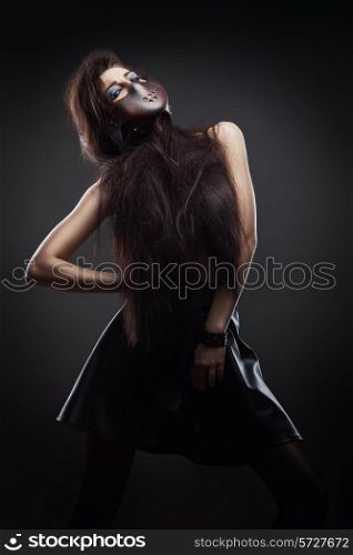 woman in leather mask and skirt