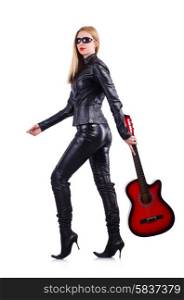 Woman in leather suit with guitar on white