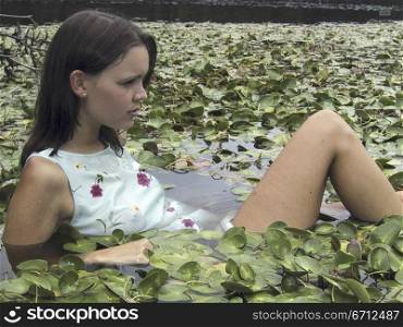 Woman in lilly pond
