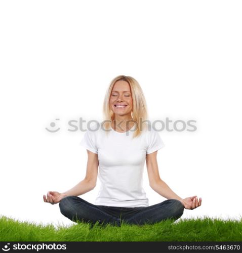 Woman in lotus position sitting on grass, studio isolated on white background