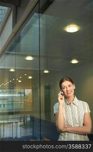 Woman in Office on Cell Phone