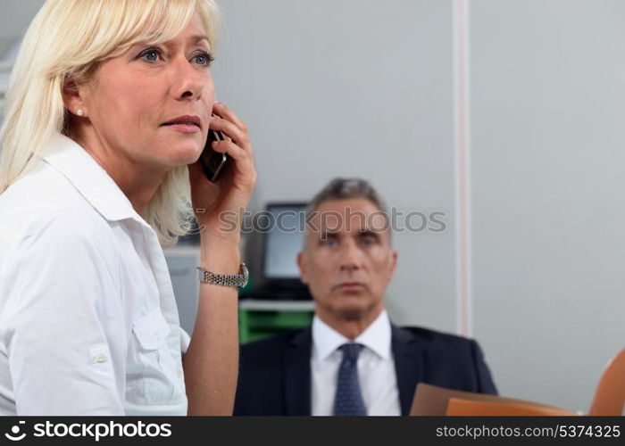 Woman in office with colleague