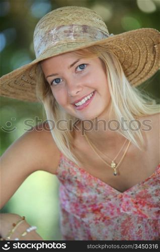 Woman in park wearing hat