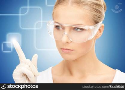 woman in protective glasses and gloves working with virtual screen