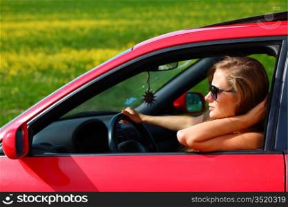 woman in red car get out window