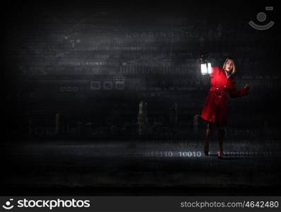 Woman in red coat with lantern lost among binary code. Computer security concept