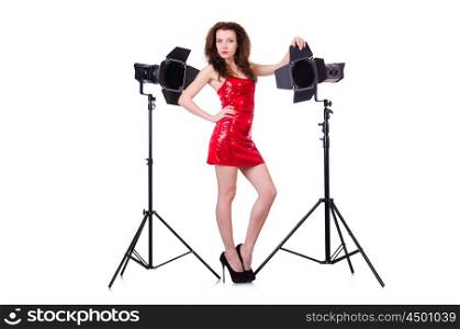 Woman in red dress posing in the studio