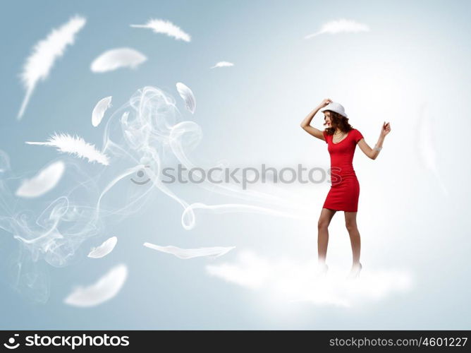 Woman in red. Pretty woman in red dress and white hat