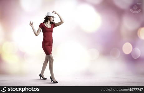 Woman in red. Pretty woman in red dress and white hat