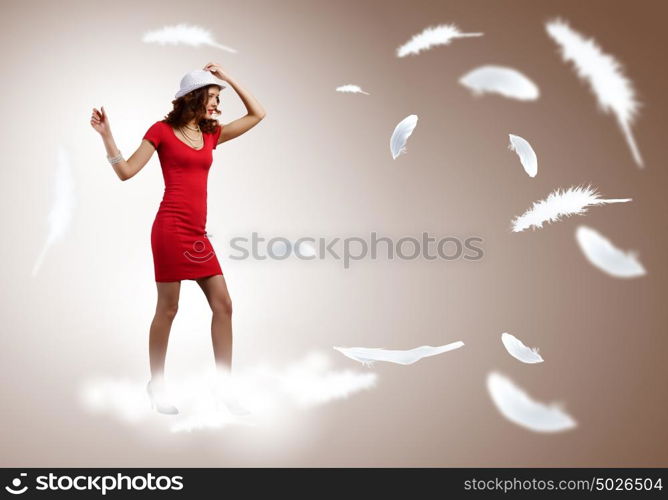 Woman in red. Pretty woman in red dress and white hat