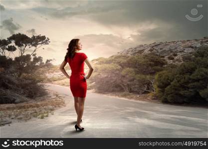Woman in red. Rear view of young woman in red dress