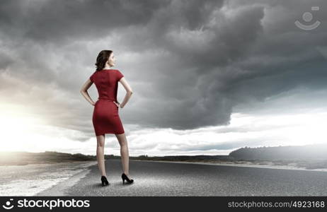 Woman in red. Rear view of young woman in red dress