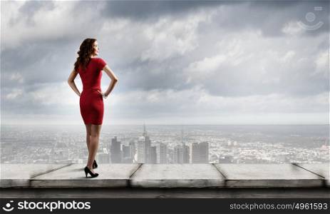 Woman in red. Rear view of young woman in short red dress