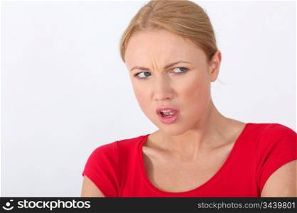 Woman in red shirt with angry look