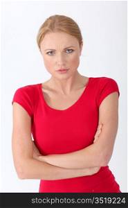 Woman in red shirt with sad look on her face