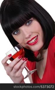 Woman in red with a glass of rose