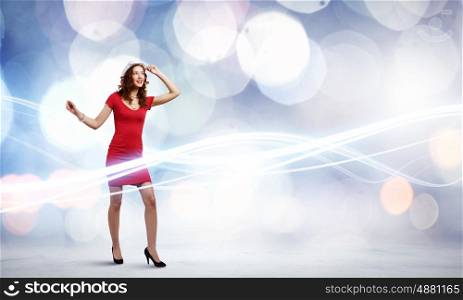 Woman in red. Woman in red dress against bokeh background