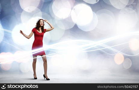 Woman in red. Woman in red dress against bokeh background