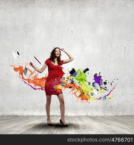 Woman in red. Woman in red dress among colorful splashes