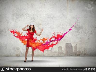 Woman in red. Woman in red dress among colorful splashes