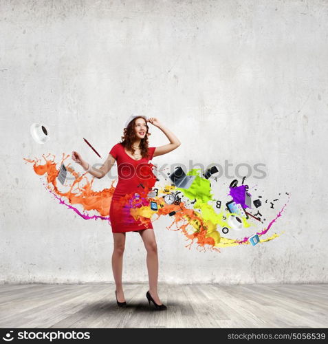 Woman in red. Woman in red dress among colorful splashes