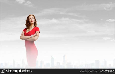 Woman in red. Young pretty brunette woman in red dress