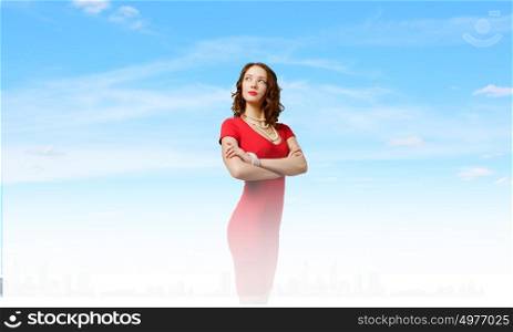 Woman in red. Young pretty brunette woman in red dress