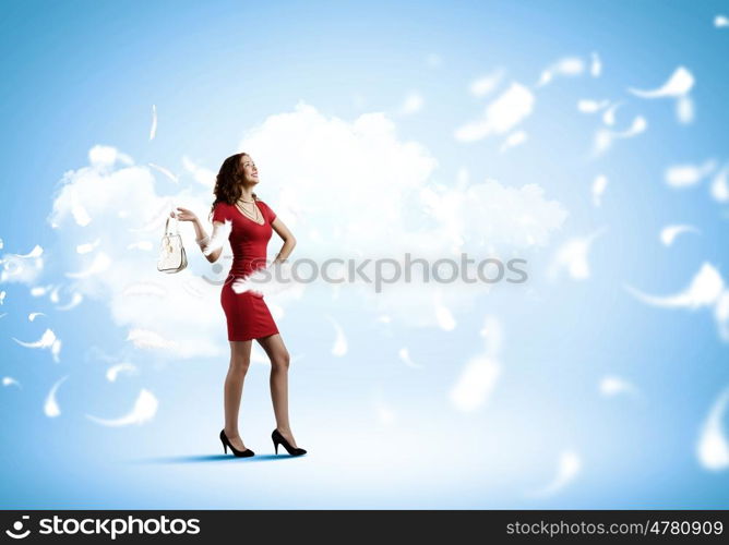Woman in red. Young pretty woman in red dress and hat