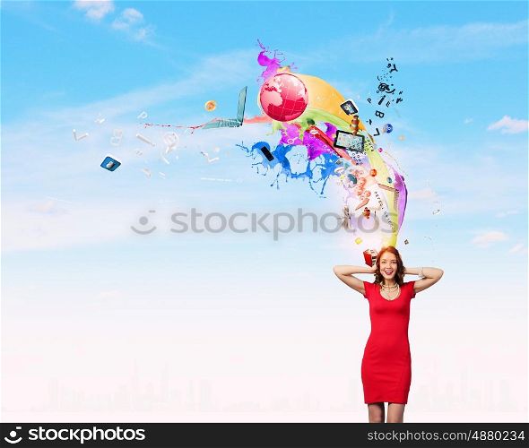 Woman in red. Young pretty woman in red dress covering ears with hands