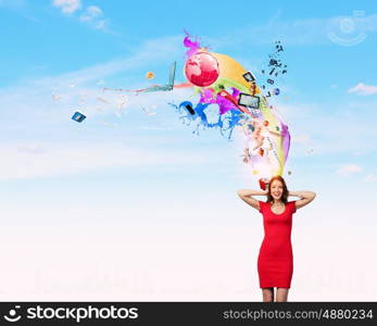 Woman in red. Young pretty woman in red dress covering ears with hands