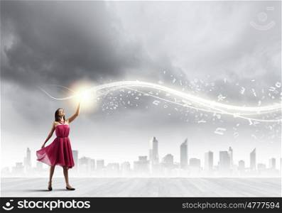 Woman in red. Young woman in red dress against city background