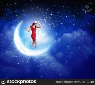 Woman in red. Young woman in red dress walking on moon